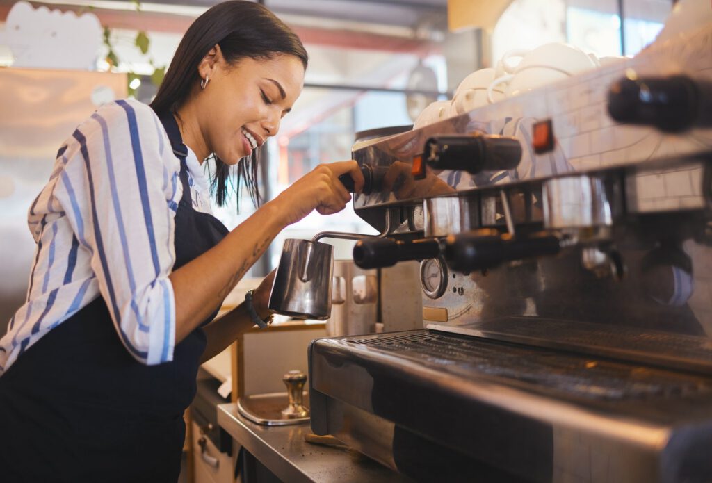 Coffee shop, cafe and restaurant with a barista working as a startup entrepreneur and small busines